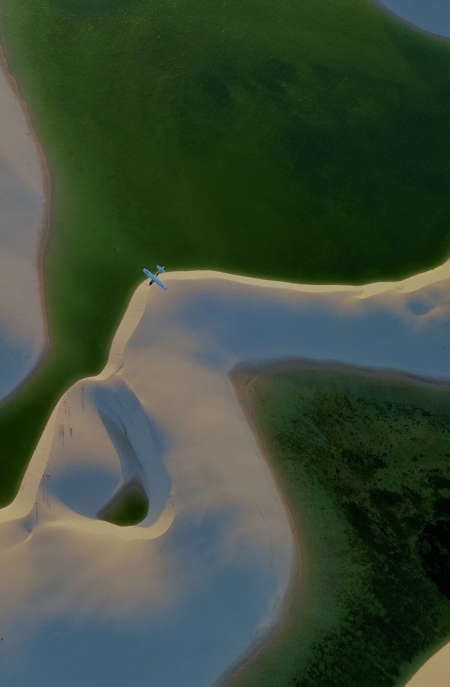 Aerial of white sand dunes and blue lagoons, Lencois Maranhenses, Brazil